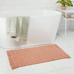 20"x32" Square Tufted Bath Rug Clay Pink - Thresholdâ˘